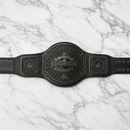 Black championship belt on a marble background