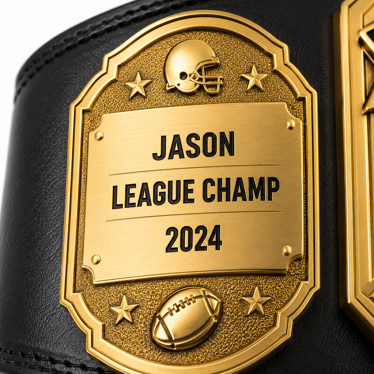 A close-up of a black leather championship belt with a large gold-tone metal plaque engraved with 'JASON LEAGUE CHAMP 2024', featuring a football helmet and football details.