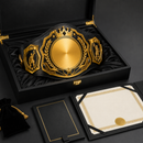 Gold championship belt in a black display case with a certificate on a dark background