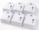 Stacks of white martial arts uniforms with a logo on a white background